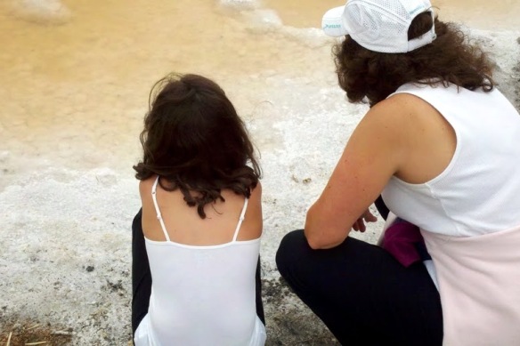 Kneeling at the salt beach